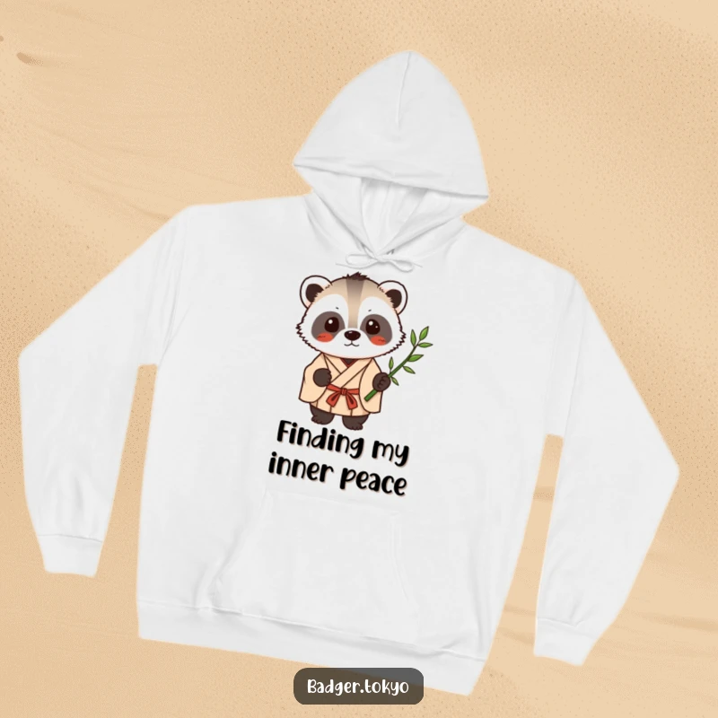 Funny Kawaii badger in a simple kimono holding a single bamboo stalk, a cozy and humorous hoodie design.